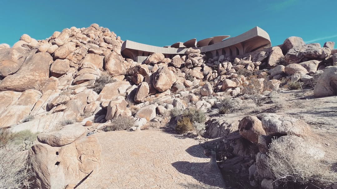 High Desert architecture surrounded by boulders wa...