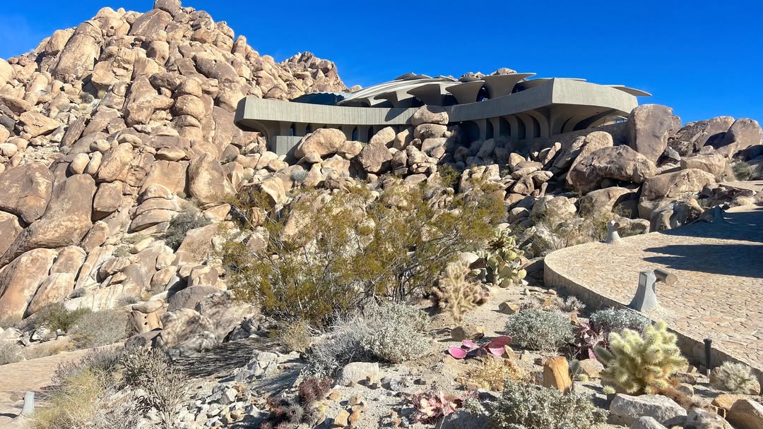High Desert architecture surrounded by boulders wa...
