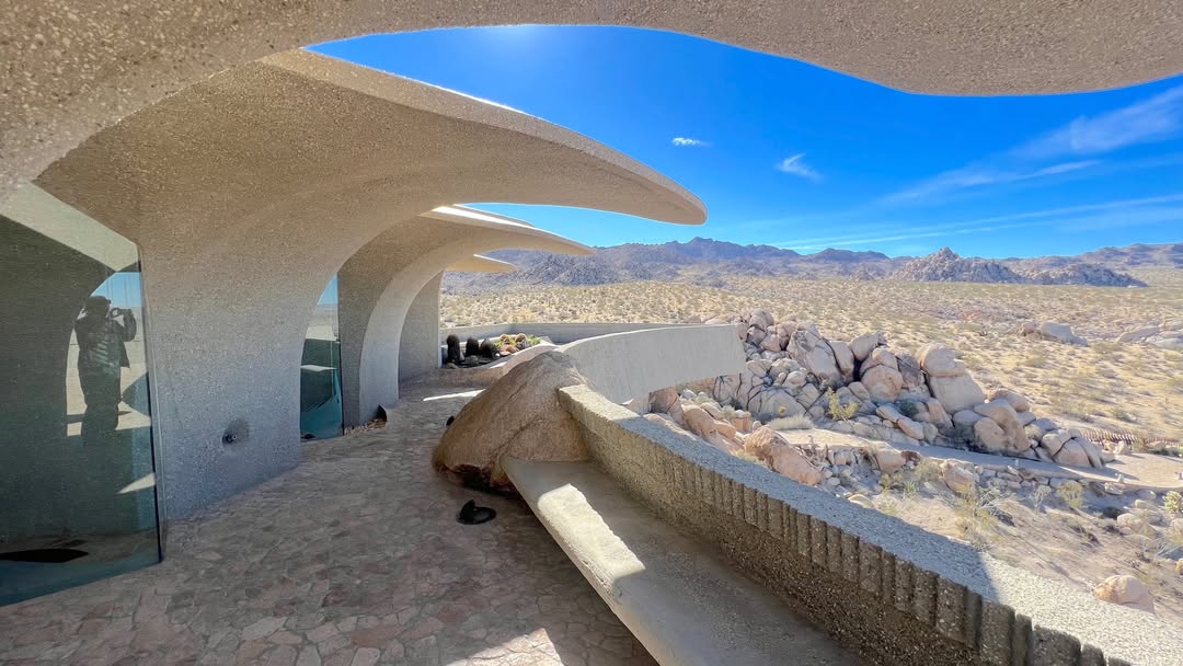 High Desert architecture surrounded by boulders wa...