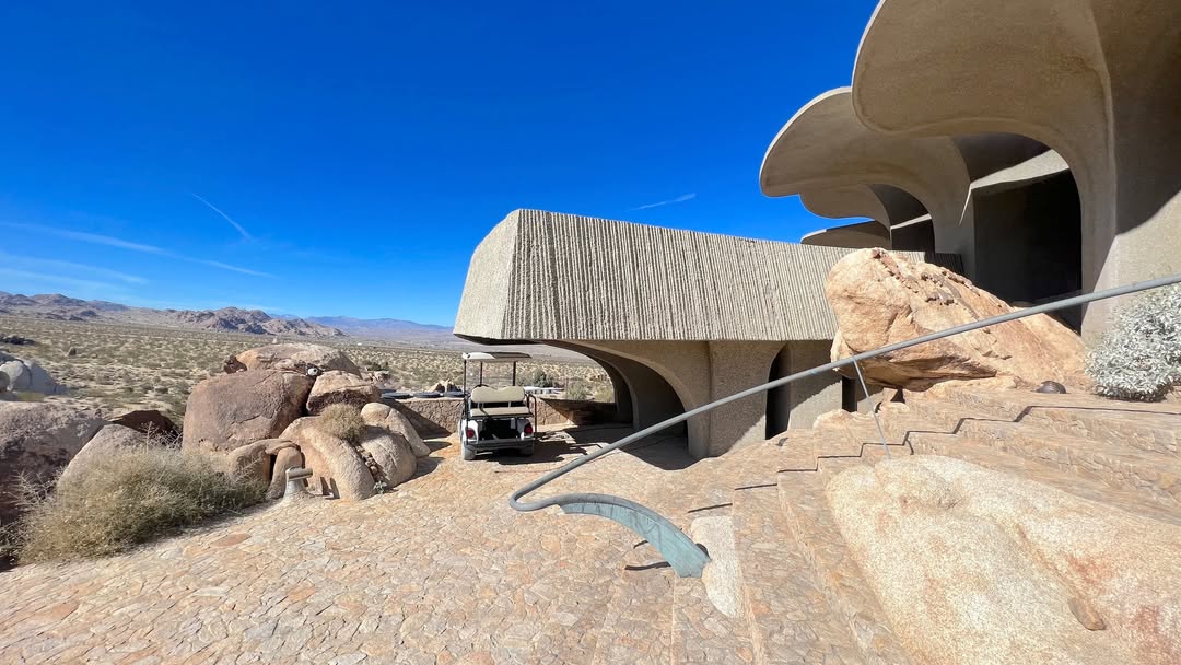 High Desert architecture surrounded by boulders wa...